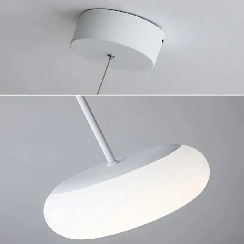 Minimalist frosted white glass pendant lamp with disc-shaped diffuser and cylindrical mount for dining table decorbites itka pendant lamp