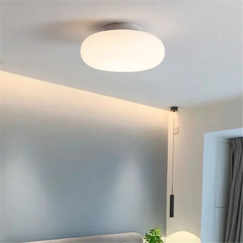 Minimalist frosted white glass pendant lamp with sleek round diffuser and white base for dining table decorbites itka pendant
