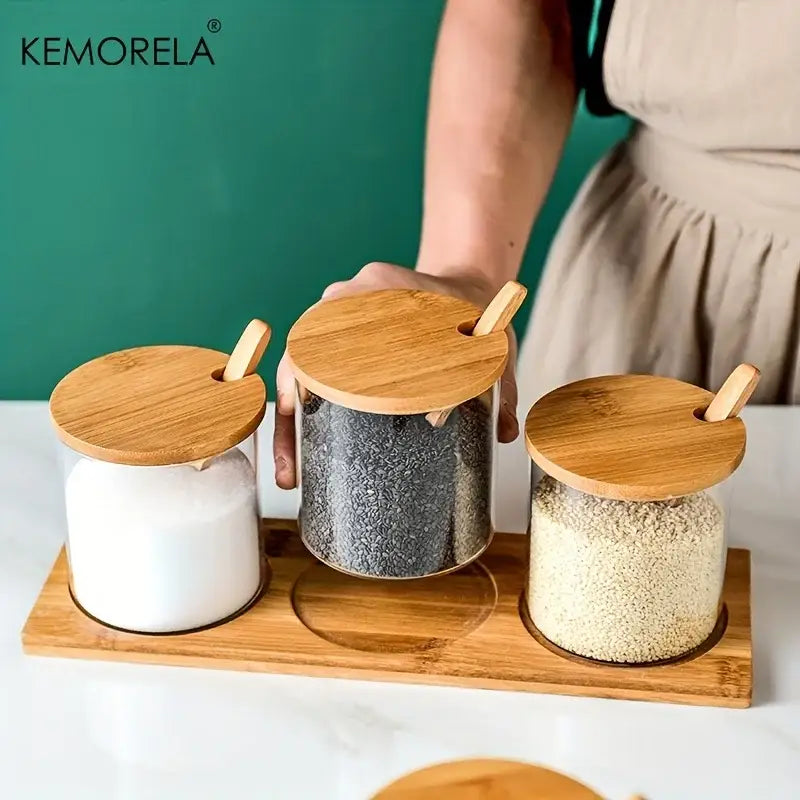 Minimalist glass spice jar set with clear glass jars, bamboo lids, and wooden spoons for kitchen organization