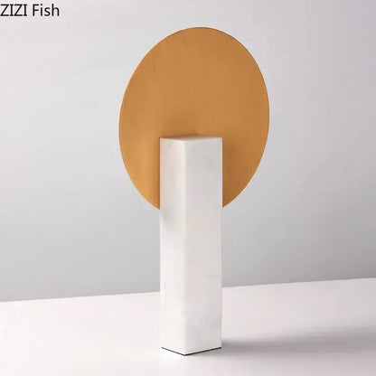 Minimalist desk decoration featuring a gold-toned geometric windmill on a white marble base for living room use