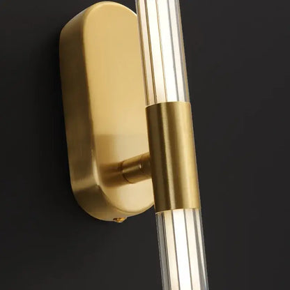 Gold-toned decorbites acrylic line wall lights with sleek rectangular backplate and clear acrylic rods for bedroom lighting