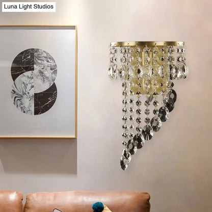 Minimalist gold-toned corridor sconce with cascading clear crystal beads and discs e12 bulb base light type