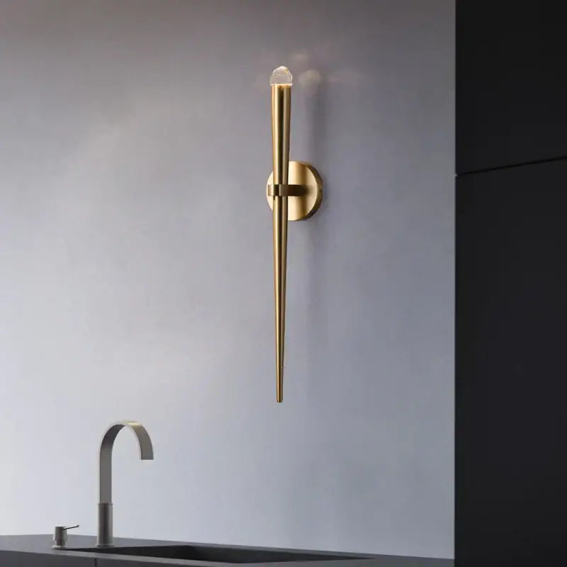 Minimalist gold crystal wall sconce with sleek elongated design and clear crystal accent for bedroom decorbites crystal minimalist decor