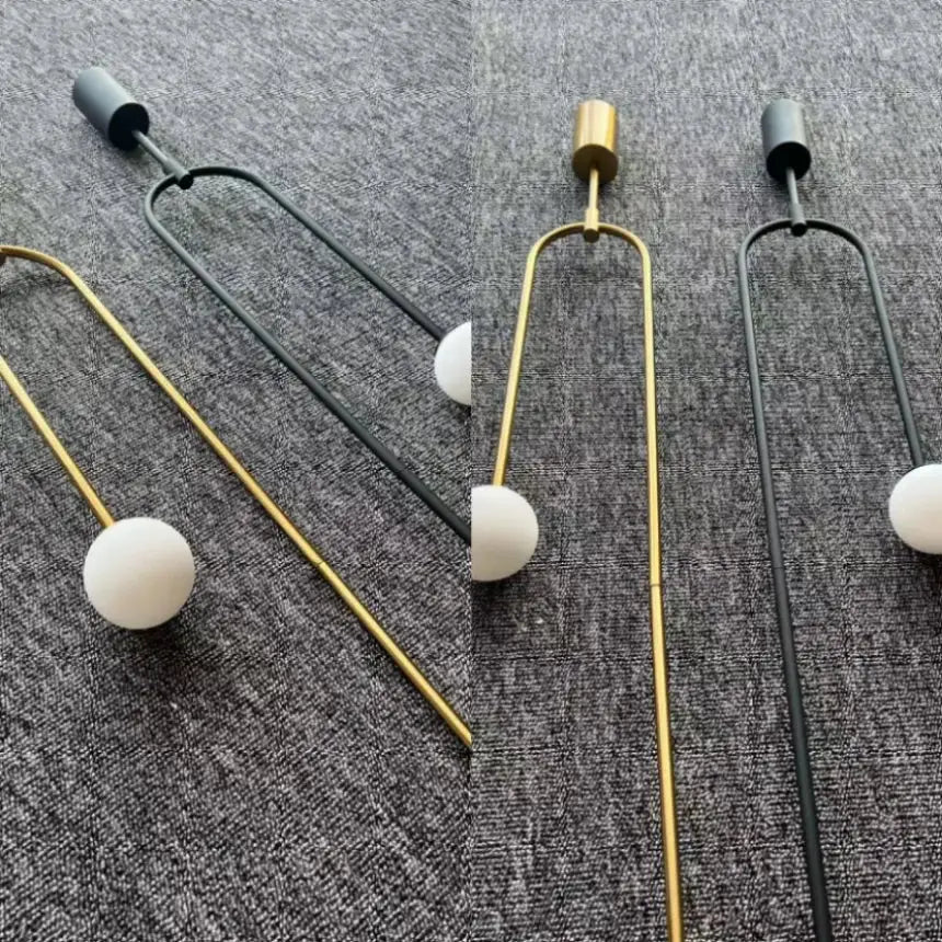Minimalist gold double head glass ball pendant light with u-shaped metal frame and matte white spherical bulb