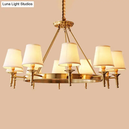 Minimalist gold fabric bedroom conical ceiling chandelier with six cream fabric shades and twisted brass chain