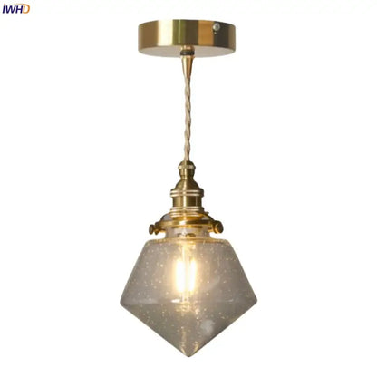 Minimalist gold led hanging light with faceted speckled bubble glass shade and twisted cord suspension for dining room