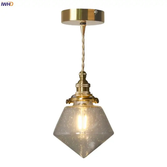 Minimalist gold led hanging light with faceted speckled bubble glass shade and twisted cord suspension for dining room