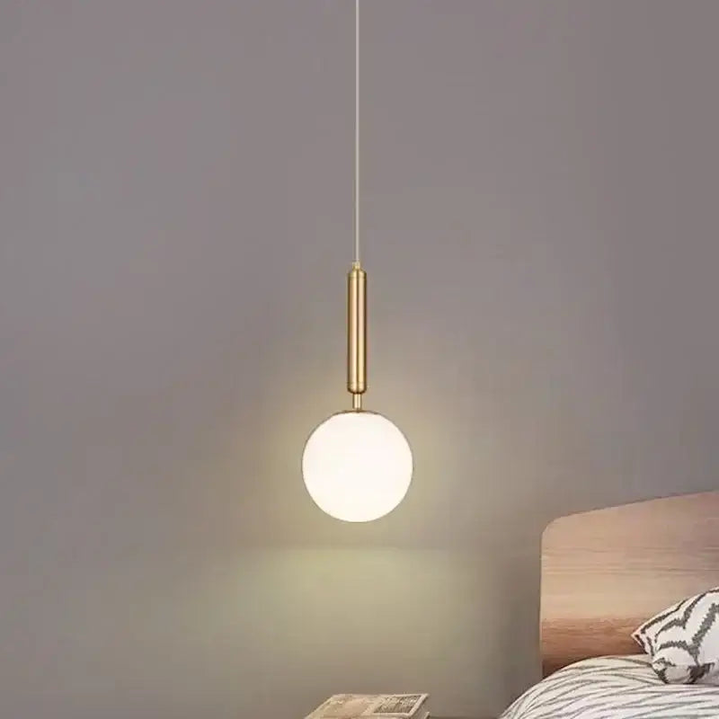Minimalist gold glass ball led pendant chandelier with frosted glass globe and cylindrical stem for kitchen island decorbites pendant chandelier