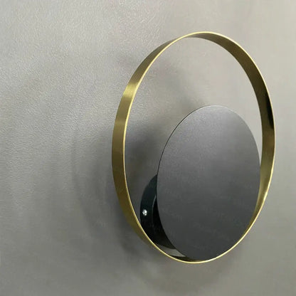 Minimalist gold nordic led wall sconce with sleek gold metal frame and matte black mirrored disc for bedroom lighting