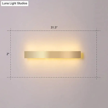 Minimalist gold plated led wall sconce with a sleek rectangular design for living room or bar lighting