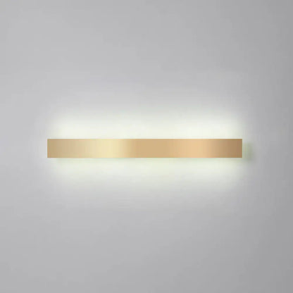 A sleek minimalist gold plated led wall sconce with a smooth metallic finish for living room or bar lighting