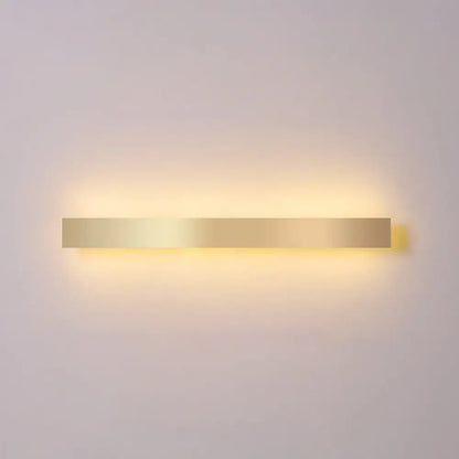 Minimalist gold plated rectangular wall sconce with a warm glow for living room and bar lighting