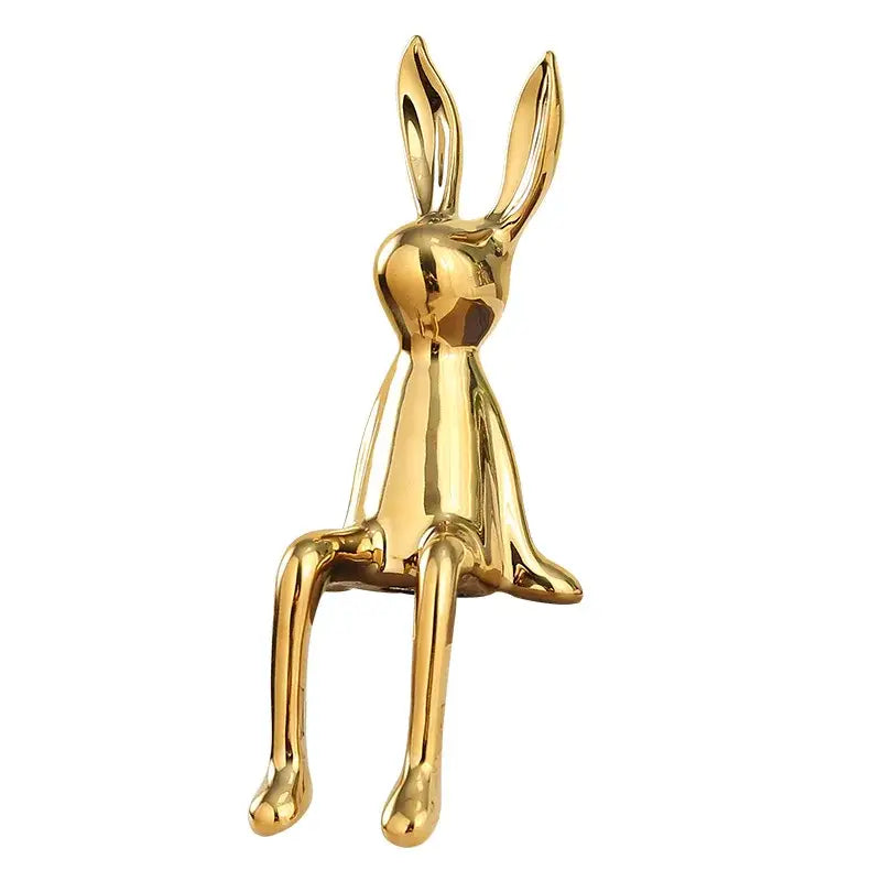 Minimalist gold rabbit ceramic ornament with sleek reflective surface and stylized design for living room decorbites decor