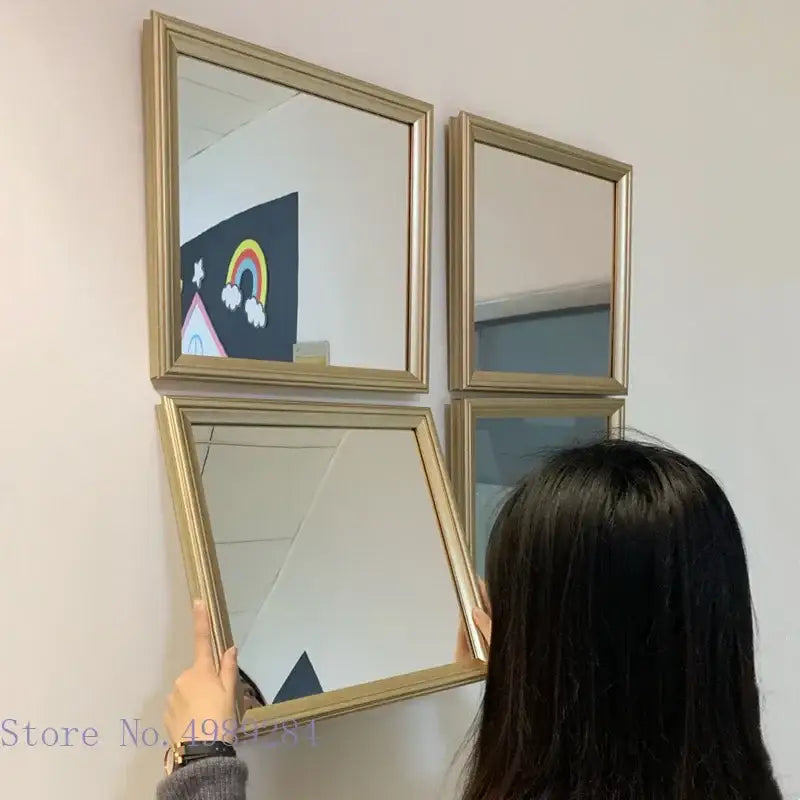 Minimalist rectangular mirror wall decor with gold-framed golden border and subtle metallic sheen for living room use