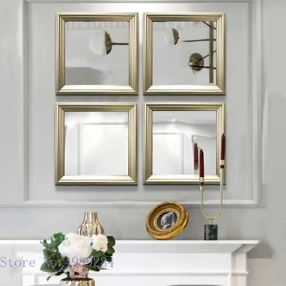 Set of four minimalist golden border square mirrors wall decor arranged in a grid above a white mantelpiece