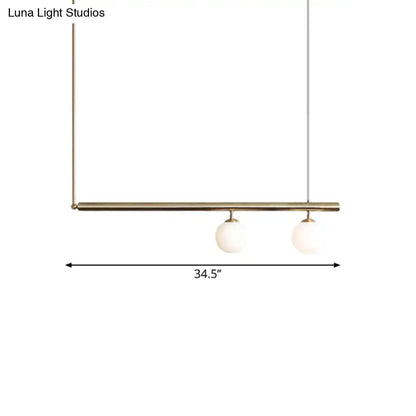 DecorBites™ golden glass shade hanging lamp with brass bar and white glass globes for dining room lighting
