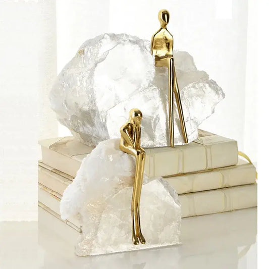 Minimalist golden man sculpture bookends with sleek smooth surfaces for home decor decorbites golden man design