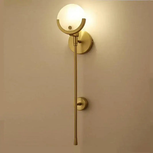 Minimalist golden marble wall lamp featuring gold-toned sconce with frosted glass globe for bedroom and living room decorbites golden marble