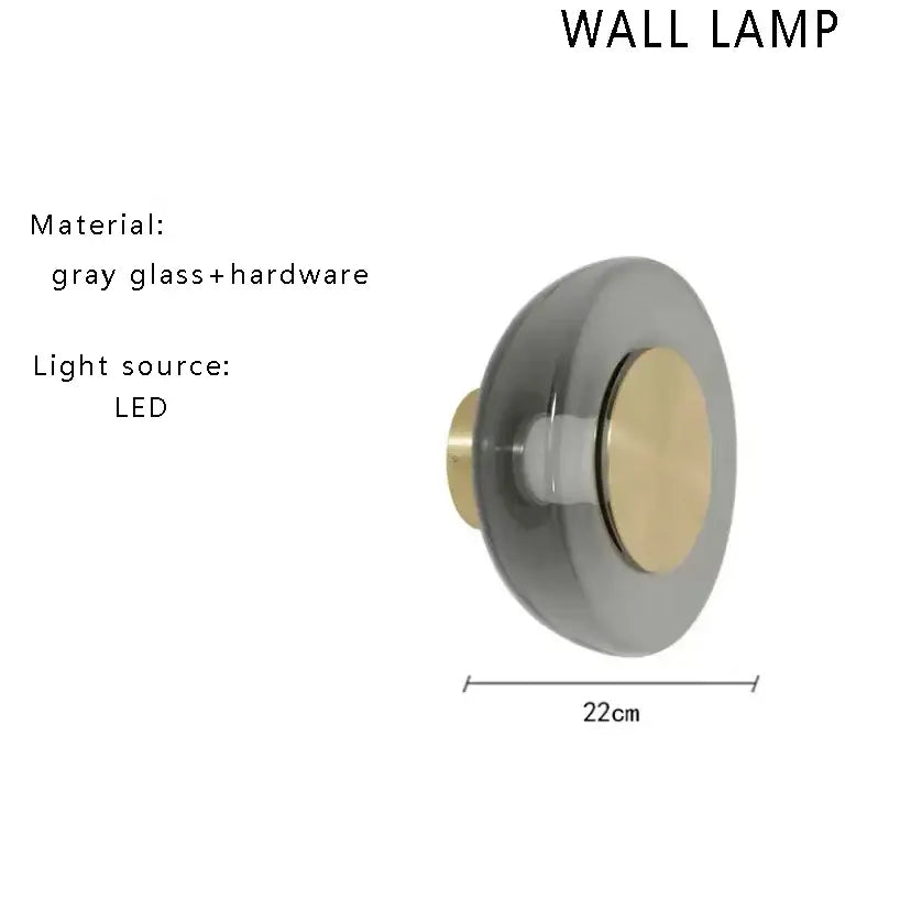 Minimalist gray glass floor lamp with brass accent and led light source for modern living room decor
