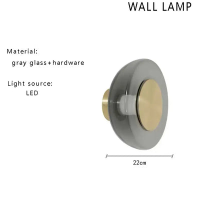 Minimalist gray glass floor lamp with brass accent and led light source for modern living room decor