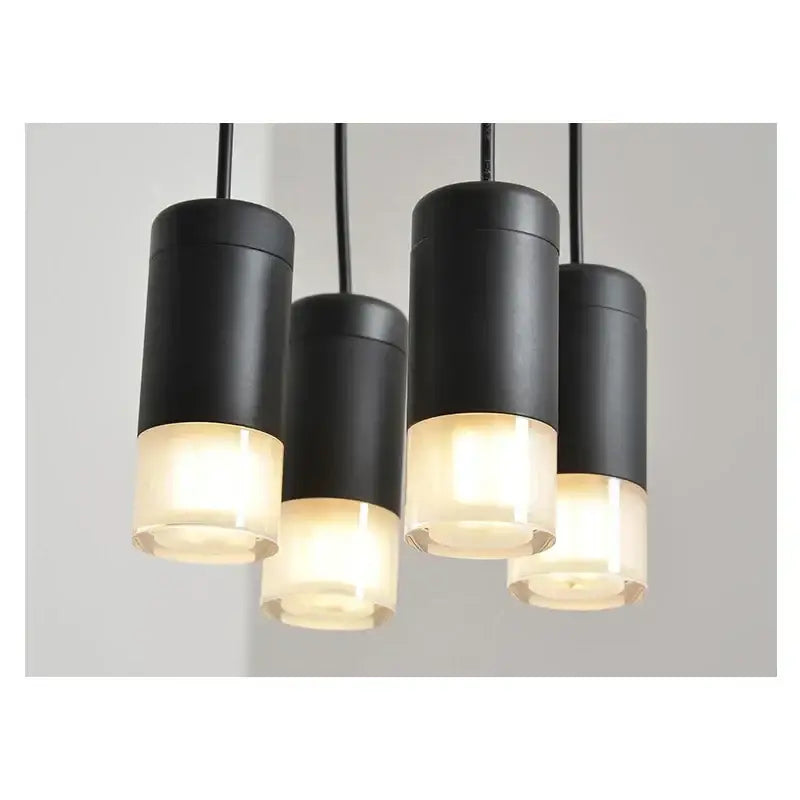 Set of four minimalist led black vintage wall lamps with cylindrical metal bodies and frosted glass diffusers for decorbites