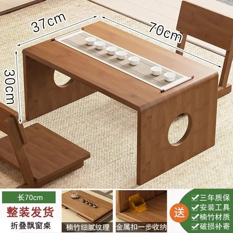Minimalist light brown bamboo folding table with circular cutouts and built-in tray holding six white ceramic cups