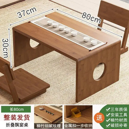 Minimalist light brown bamboo folding table with natural wood finish and built-in tray for six white ceramic teacups