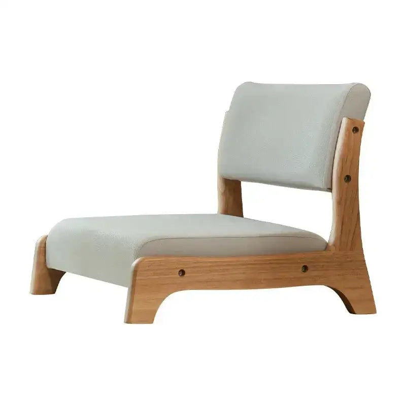 Minimalist legless tatami chair with wooden frame and light gray upholstered seat and backrest for meditation use