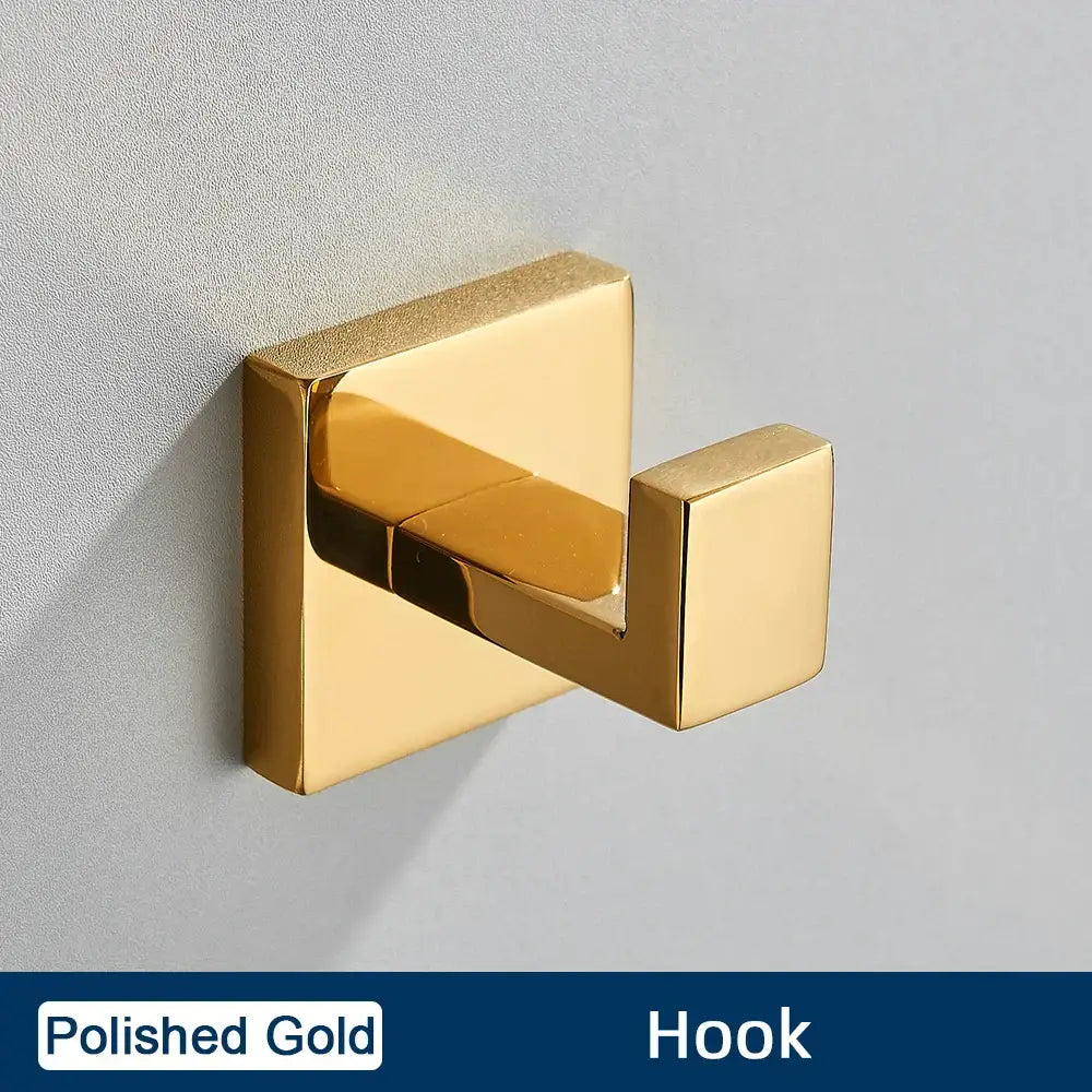 Polished gold square wall hook in a minimalist matte black stainless steel bathroom accessories set