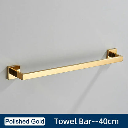 Polished gold towel bar with sleek rectangular design and square brackets in minimalist matte black stainless steel bathroom accessories set