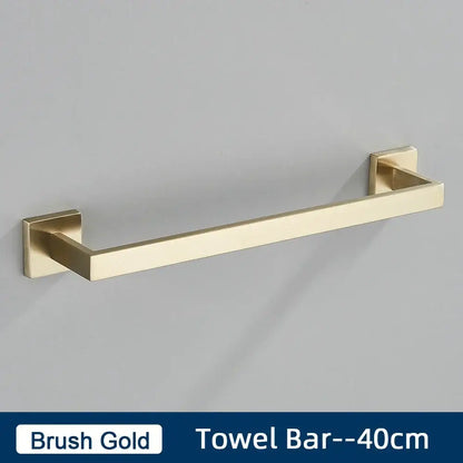 Brush gold towel bar with square mounting plates in a minimalist matte black stainless steel bathroom accessories set