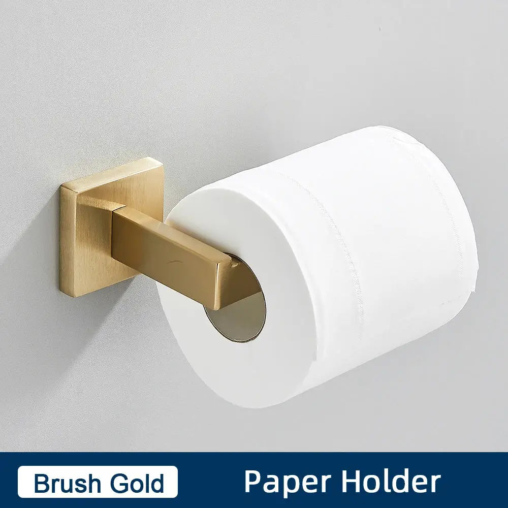 Brush gold bathroom paper holder in a minimalist matte black stainless steel bathroom accessories set holding white paper roll