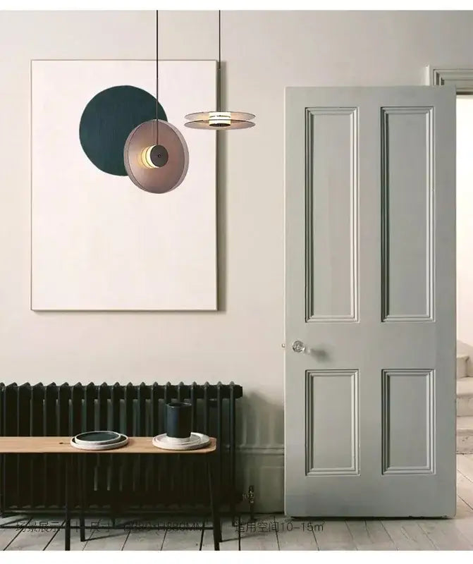 Modern minimalist glass pendant lights with matte bronze and dark teal tones for dining room warm led illumination