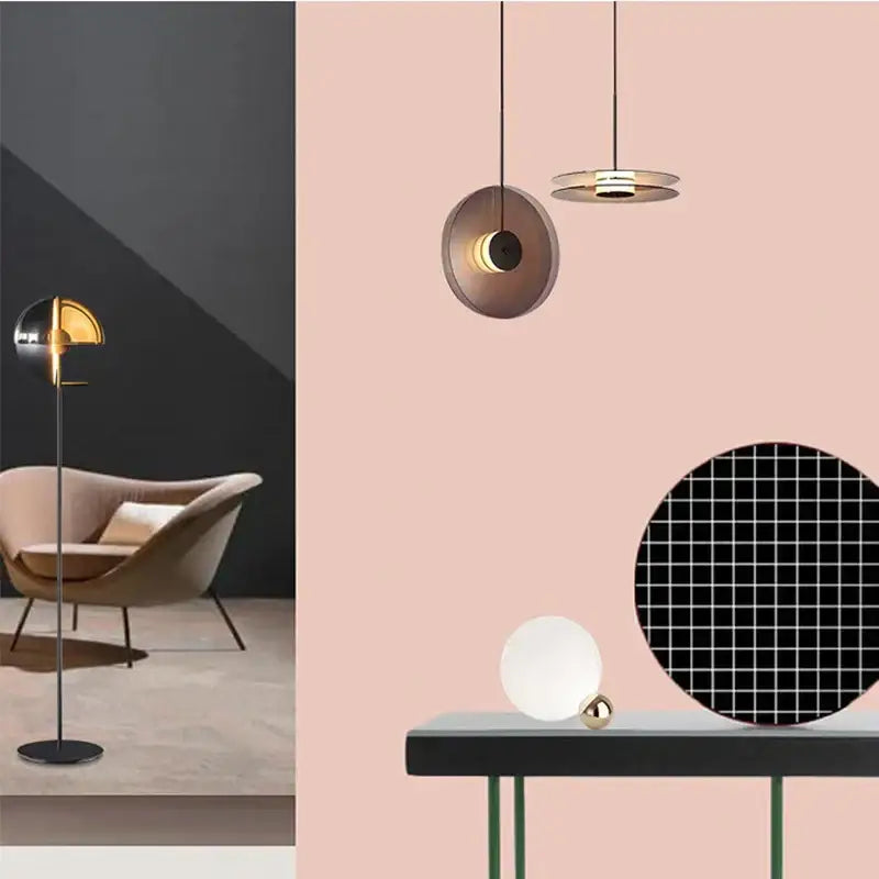 Modern minimalist pendant lights with circular brass and black glass pendant shades for warm dining room illumination
