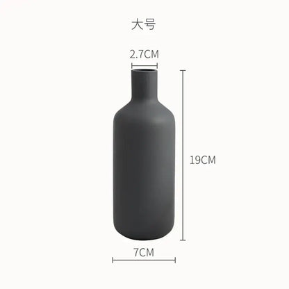 A sleek matte black ceramic geometric vase with minimalist bottle shape for living room decorbites geometric ceramic use