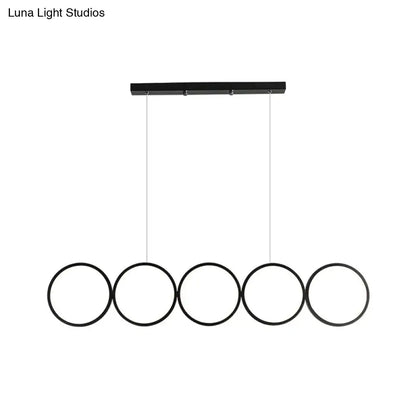 Black minimalist metallic led suspension lamp with five circular rings and warm white light for modern interiors