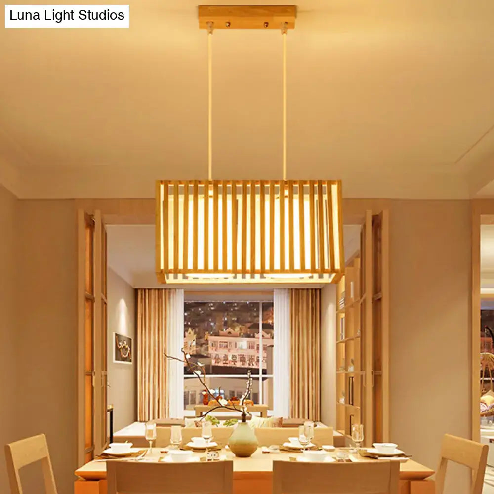 DecorBites asian wood island pendant light in natural wood finish with vertical slats and warm glowing illumination