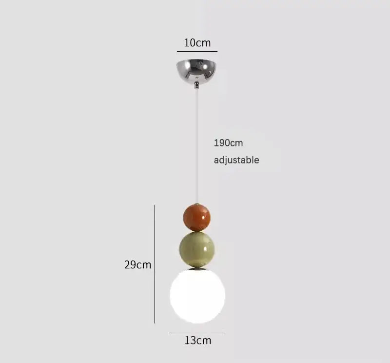 Minimalist nordic pendant light with three-tiered glossy orange, matte olive green, and frosted white glass shades for bedroom decorbites cream style