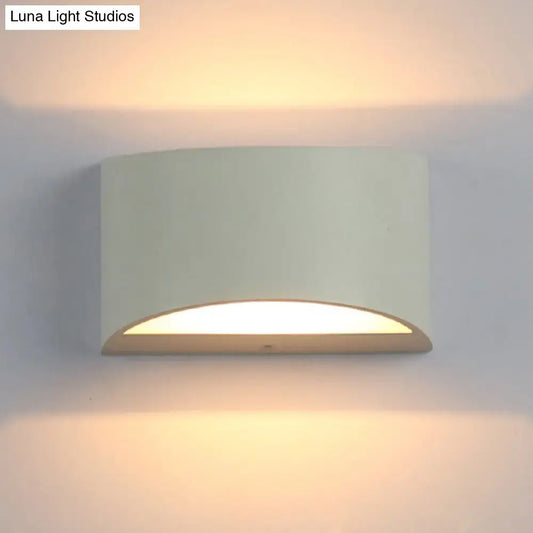 Minimalist off-white led wall light with curved metal sconce design providing warm ambient lighting for bedroom