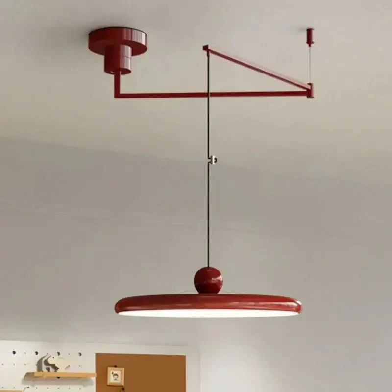 Minimalist red cream iron art pendant light with circular shade and articulated arm for bedroom decorbites cream iron