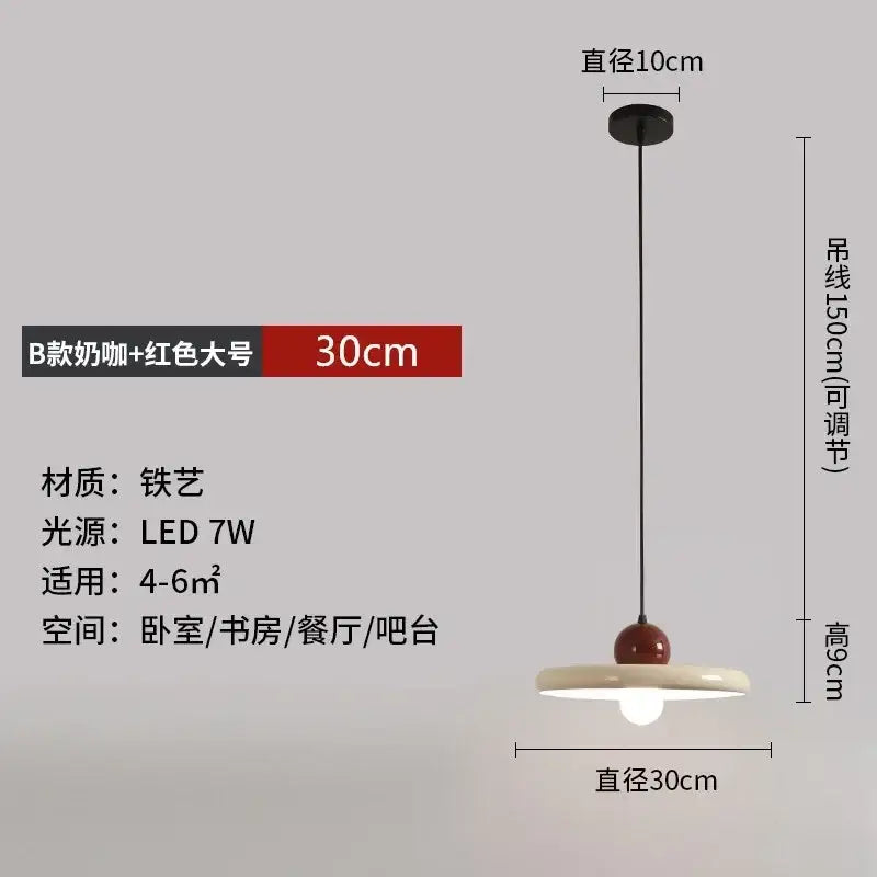 Minimalist red and white acrylic pendant light with a cream ceramic shade and cord pendant for dining rooms