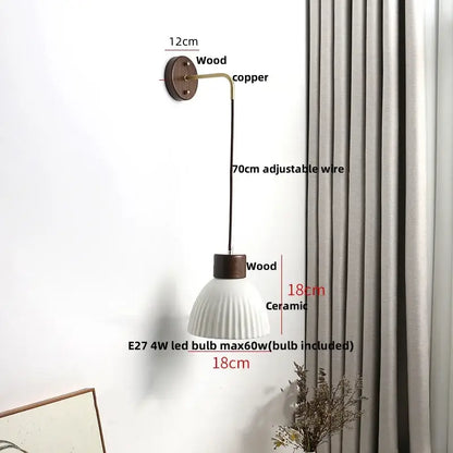 Minimalist ribbed ceramic led wall lamp with fluted white shade, dark wood accents, and adjustable copper arm for decorbites ceramic led wall decor