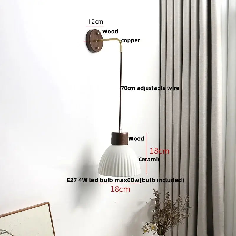 Minimalist ribbed ceramic led wall lamp with fluted white shade, dark wood accents, and adjustable copper arm for decorbites ceramic led wall decor