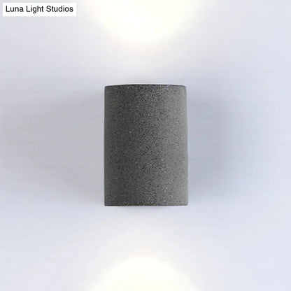 Minimalist gray speckled concrete led wall light with textured cylindrical design for living room wall light use