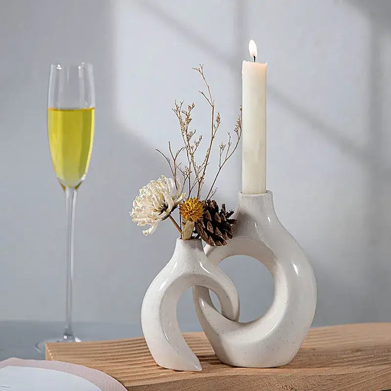Minimalist speckled off-white ceramic donut candle holder with intertwined sculptural design for dining room decorbites ceramic donut
