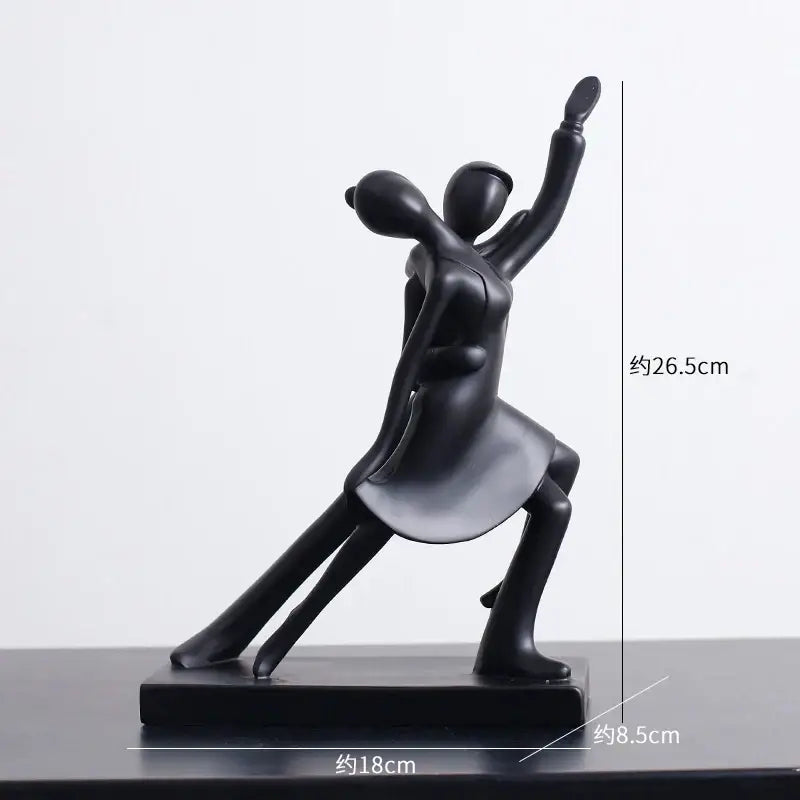 Black matte abstract figures sculpture with minimalist design on rectangular base for living room decor