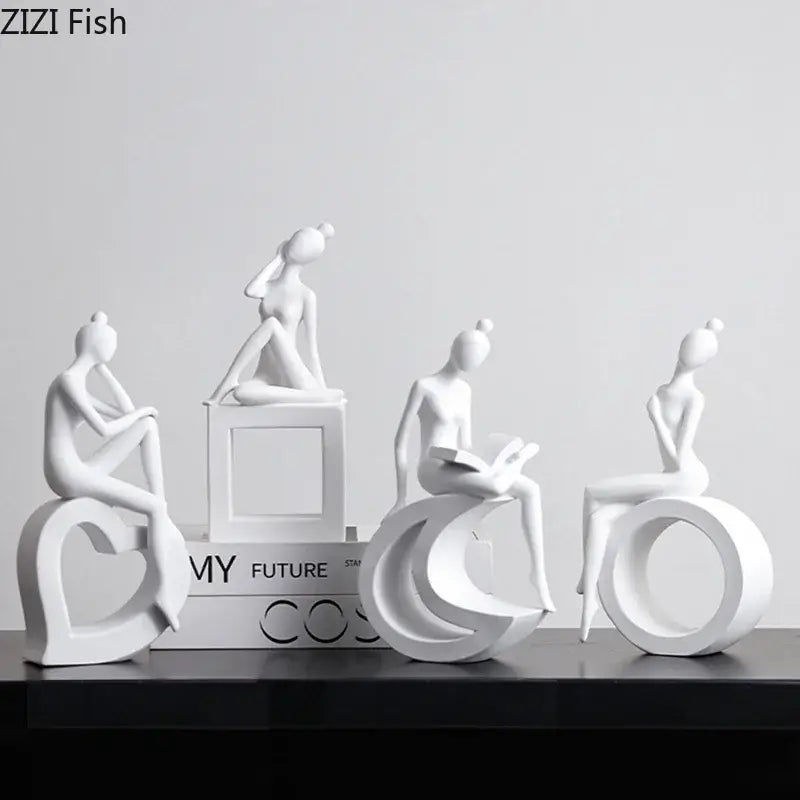Minimalist white resin abstract figures sculpture featuring stylized women on geometric bases for living room decor