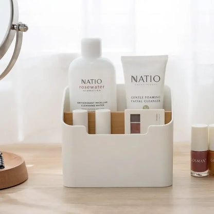 Minimalist white and wood comb-style storage rack holding natio skincare products as an office supplies storage solution