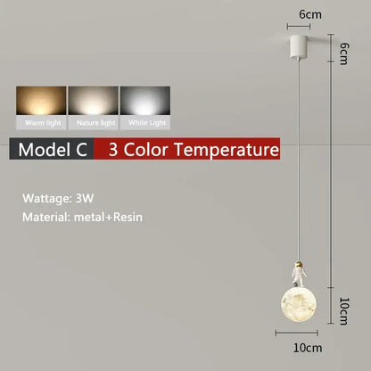 Minimalist white astronaut pendant light for children’s bedroom crafted from metal and resin with moon-shaped base
