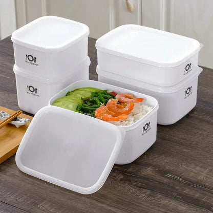 Minimalist white bento box by decorbites featuring rectangular plastic food storage containers with matching lids and logo design